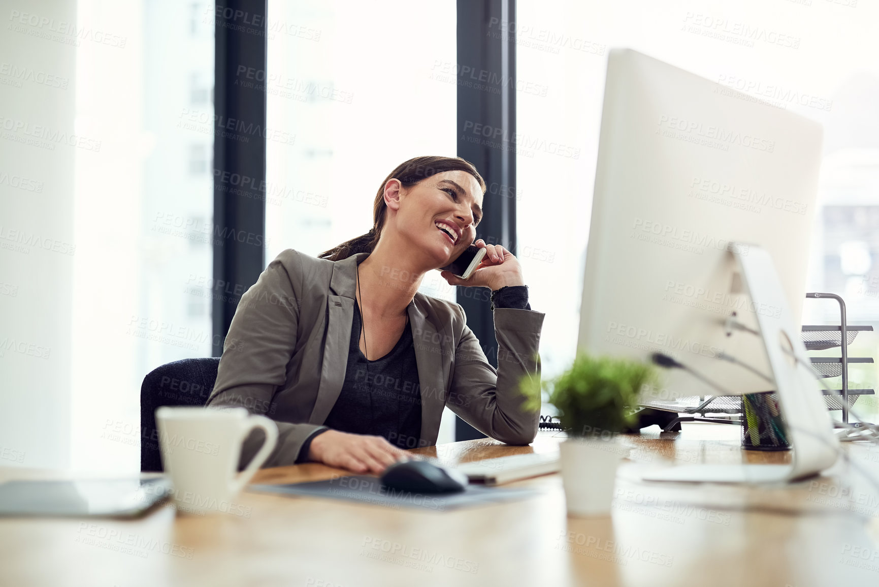 Buy stock photo Phone call, business woman and laughing by computer for news, gossip story or conversation in office. Smartphone, funny and sales consultant talking, chat and networking for communication on desktop