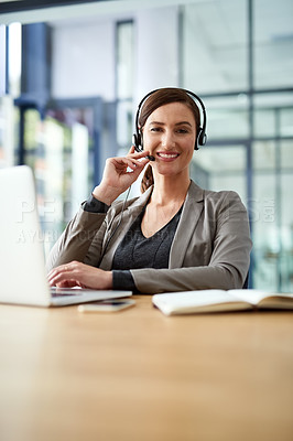 Buy stock photo Portrait of a young support agent working on a laptop in an office