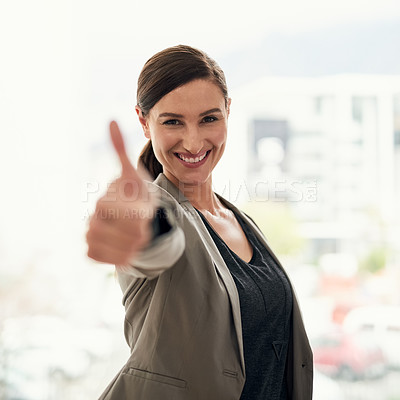 Buy stock photo Portrait of a young businesswoman showing thumbs up