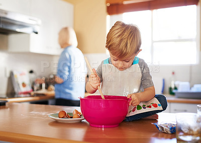 Buy stock photo Child mixing, mom and baking together in kitchen for development, relationship and growth at home. Mother, son and stirring batter on countertop for cake, learning and fun at house for bonding