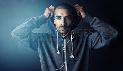 Buy stock photo Studio shot of a sporty young man standing against a dark background