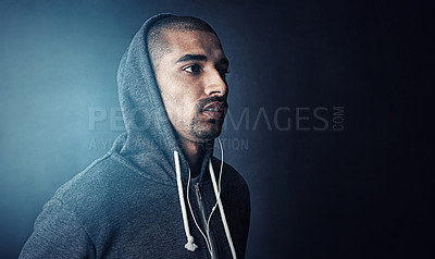 Buy stock photo Studio shot of a sporty young man standing against a dark background