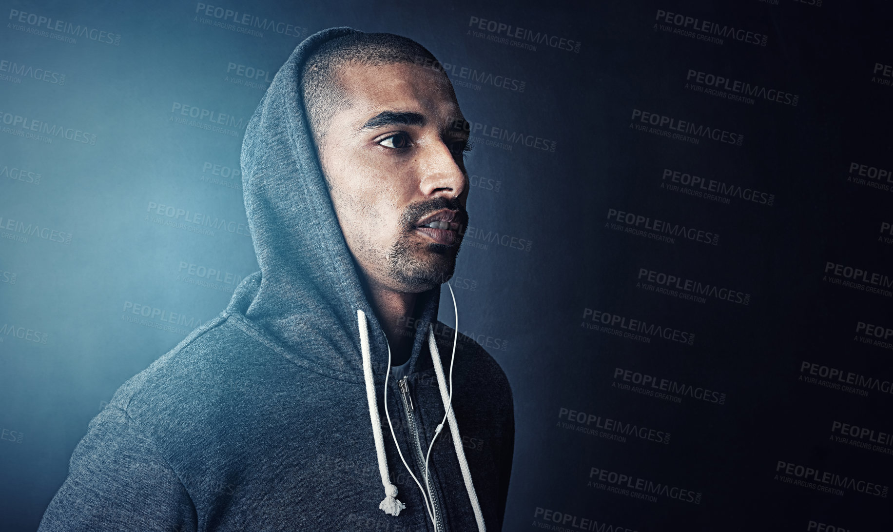 Buy stock photo Fitness, thinking and man in studio with hoodie, earphones and mockup space at gym workout. Health, wellness and athlete with music app for exercise, inspiration and confidence on dark background