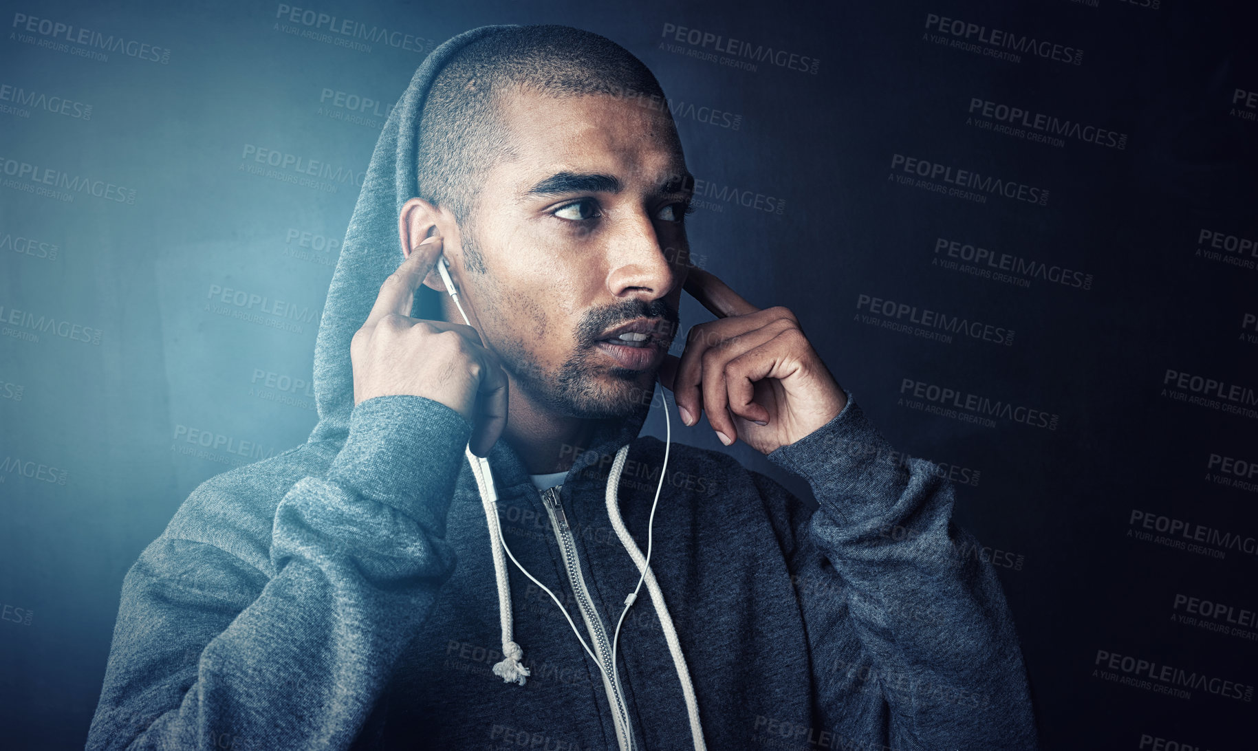 Buy stock photo Studio shot of a sporty young man standing against a dark background