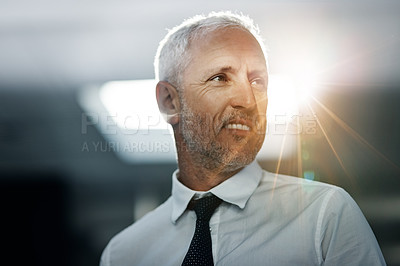 Buy stock photo Shot of a wmiling businessman standing in an office