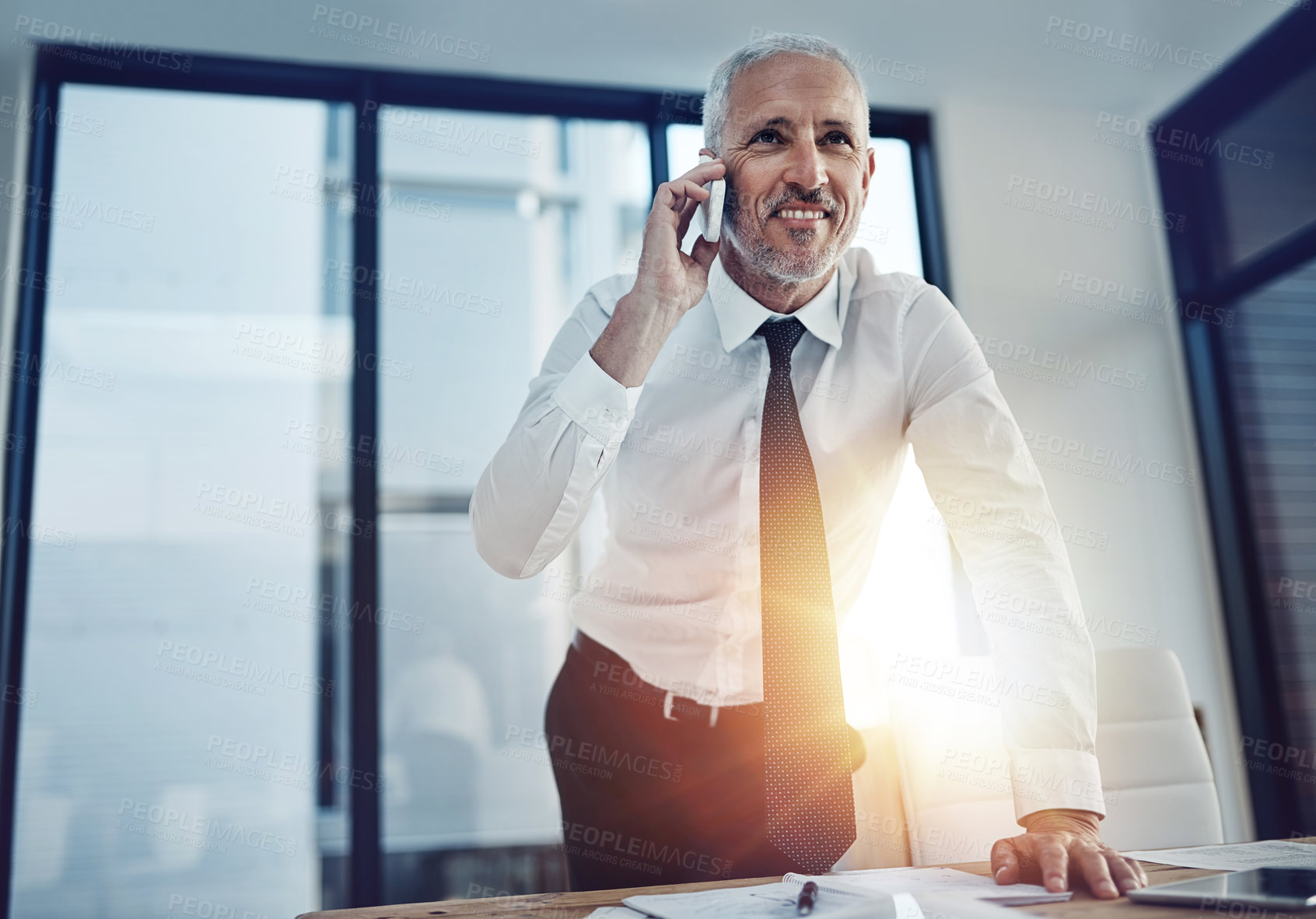 Buy stock photo Phone call, communication and mature businessman in office for finance negotiation with stakeholder. Happy, cellphone and financial investor on mobile discussion for connection, contact or networking