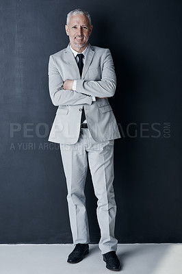 Buy stock photo Studio portrait of mature man in suit, arms crossed and smile on dark background. Confidence, pride and professional career for happy executive businessman or senior business owner or successful ceo.