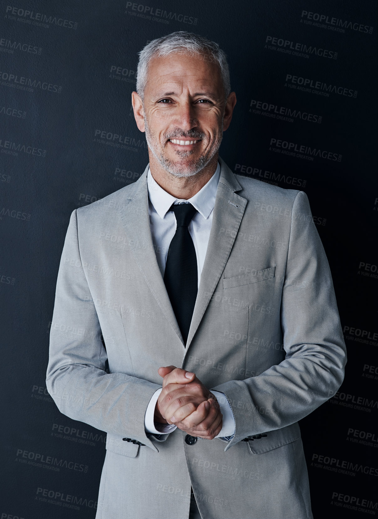 Buy stock photo Studio portrait of senior businessman in suit, smile and handsome face on dark background. Confidence, pride and professional career for happy executive man or mature business owner or successful ceo