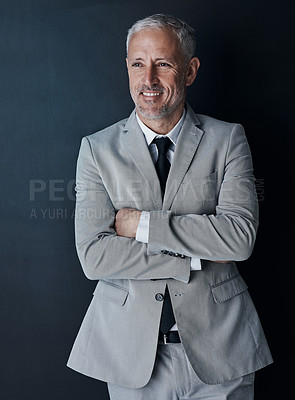 Buy stock photo Senior businessman in suit, arms crossed and smile on dark background, happy lawyer in studio. Confidence, pride and professional career for executive ceo attorney, business owner and law firm boss.