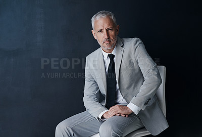 Buy stock photo Studio portrait of senior businessman on chair in mockup, confidence and serious face on dark background. Space, pride and professional career for executive man, mature business owner or startup ceo.