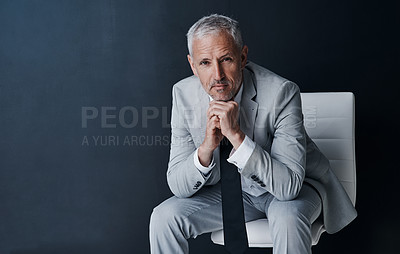 Buy stock photo Serious portrait of senior lawyer on chair with confidence, mockup space and dark background in studio. Pride, professional career ceo and executive attorney, mature businessman or law firm boss.