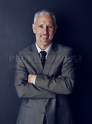 Buy stock photo Smile, confidence and studio portrait of businessman in suit, arms crossed and pride on dark background. Boss, ceo and  happy business owner with professional career, senior model executive with job.