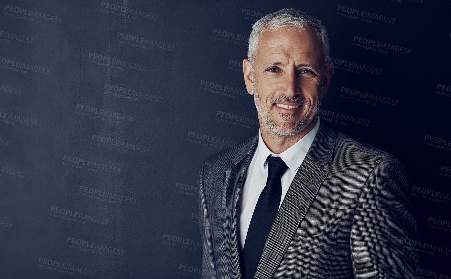 Buy stock photo Mockup, smile and studio portrait of businessman in suit, confidence and pride on dark background. Boss, ceo and business owner with professional career, senior model with executive management job.