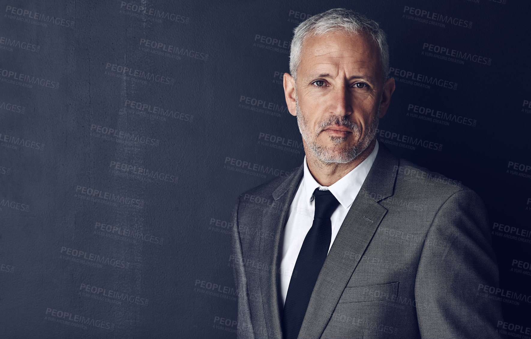 Buy stock photo Mockup, confidence and studio portrait of businessman in suit, serious and pride on dark background. Boss, ceo and business owner with professional career, senior model executive management with job.
