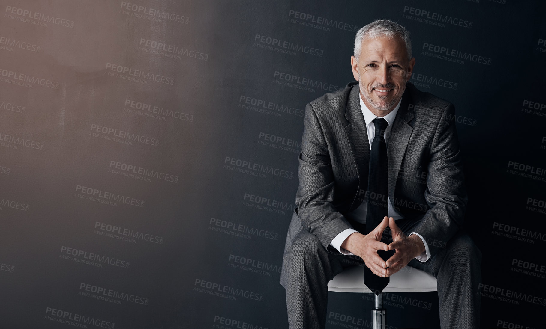 Buy stock photo Mock up, chair and happy portrait of lawyer, attorney or businessman with confidence on dark background in studio space. Boss, ceo or business owner with smile, senior executive director at law firm.