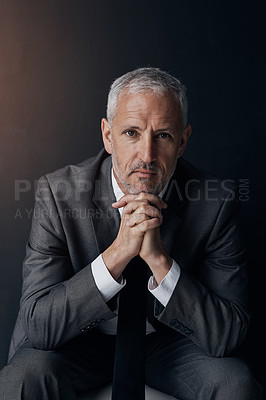 Buy stock photo Boss, chair and serious portrait of lawyer, attorney or businessman with ceo on dark background in studio. Confidence, pride and legal business owner, proud senior executive director at law firm.