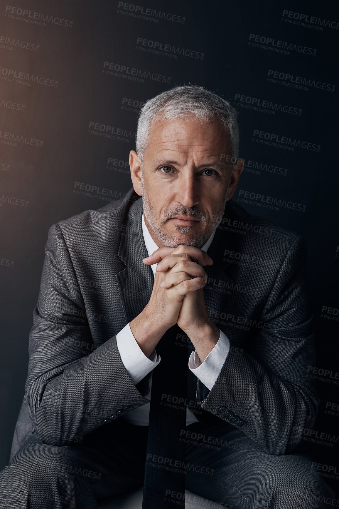 Buy stock photo Boss, chair and serious portrait of lawyer, attorney or businessman with ceo on dark background in studio. Confidence, pride and legal business owner, proud senior executive director at law firm.