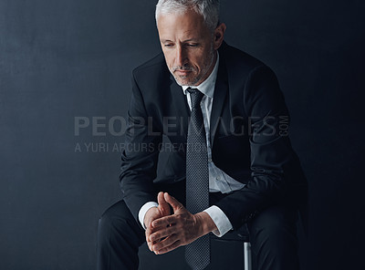 Buy stock photo Businessman, stress and thinking on crisis in studio, depression and burnout on dark background. Mature person, sad accountant and contemplating fail or stock market crash, chair and tax disaster