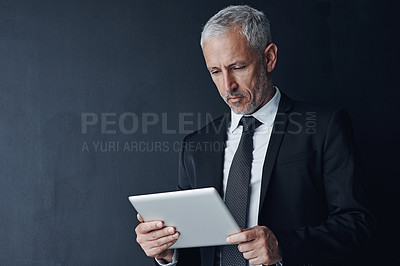 Buy stock photo Business, man and space with tablet in studio for communication, lawyer and information of court case. Mature, male attorney and digital with research, legal advice and schedule on dark background