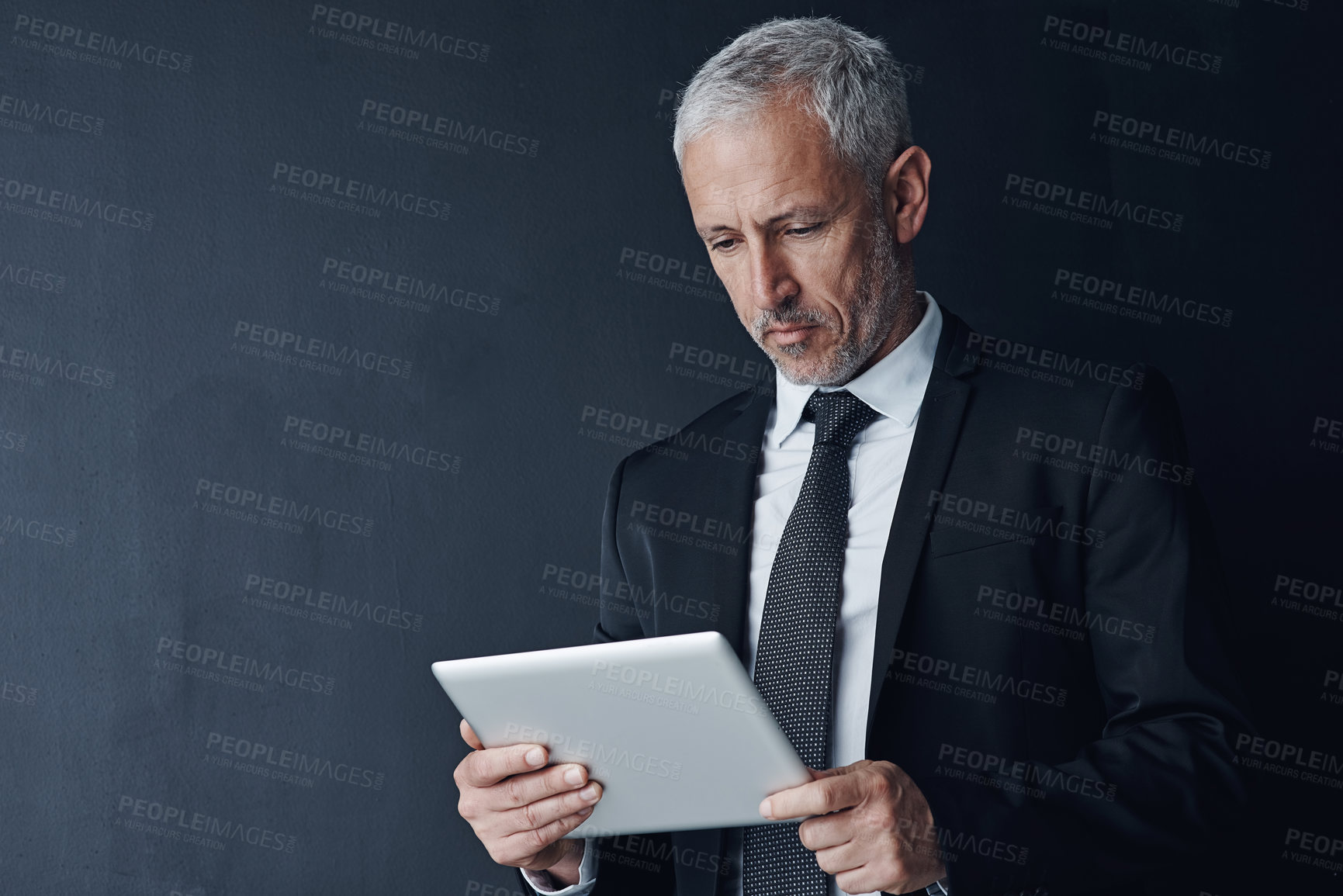 Buy stock photo Business, man and space with tablet in studio for communication, lawyer and information of court case. Mature, male attorney and digital with research, legal advice and schedule on dark background