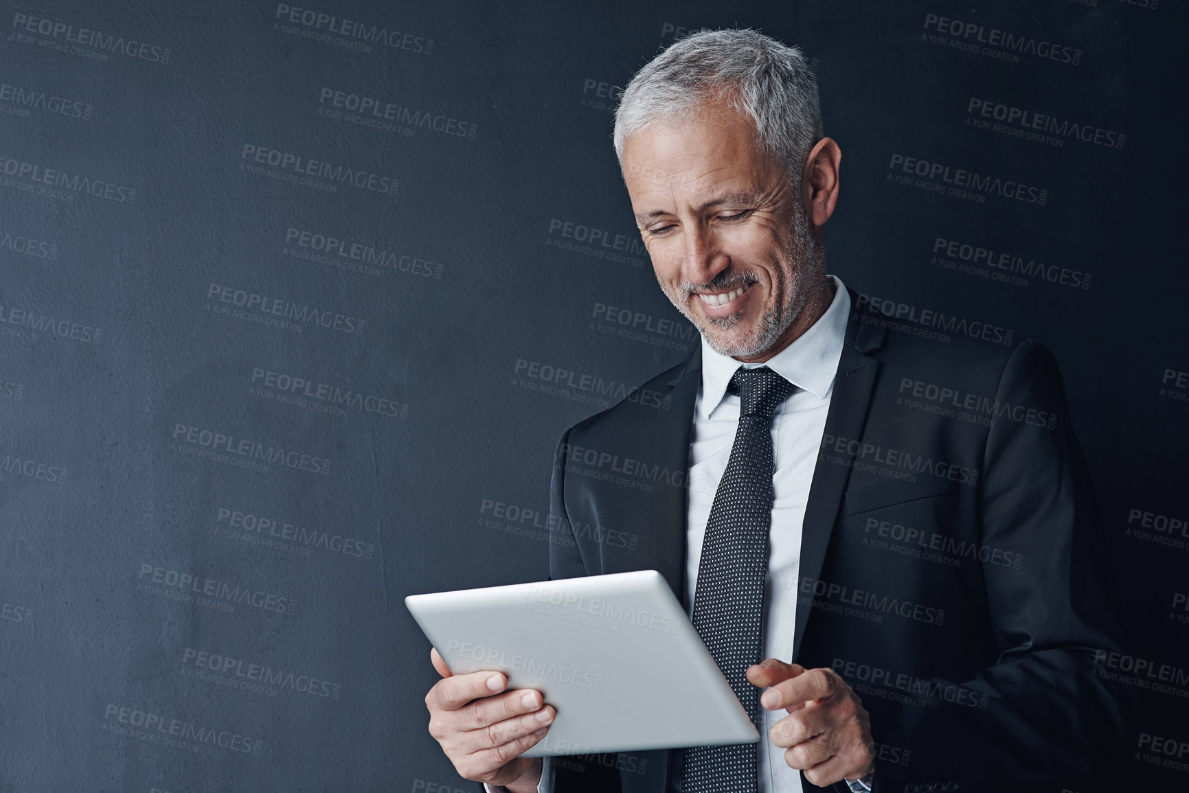 Buy stock photo Businessman, joy and online with tablet in studio for internet, website and news on stock exchange. Mature person, mockup space and happy for economy, market share and trading on black background