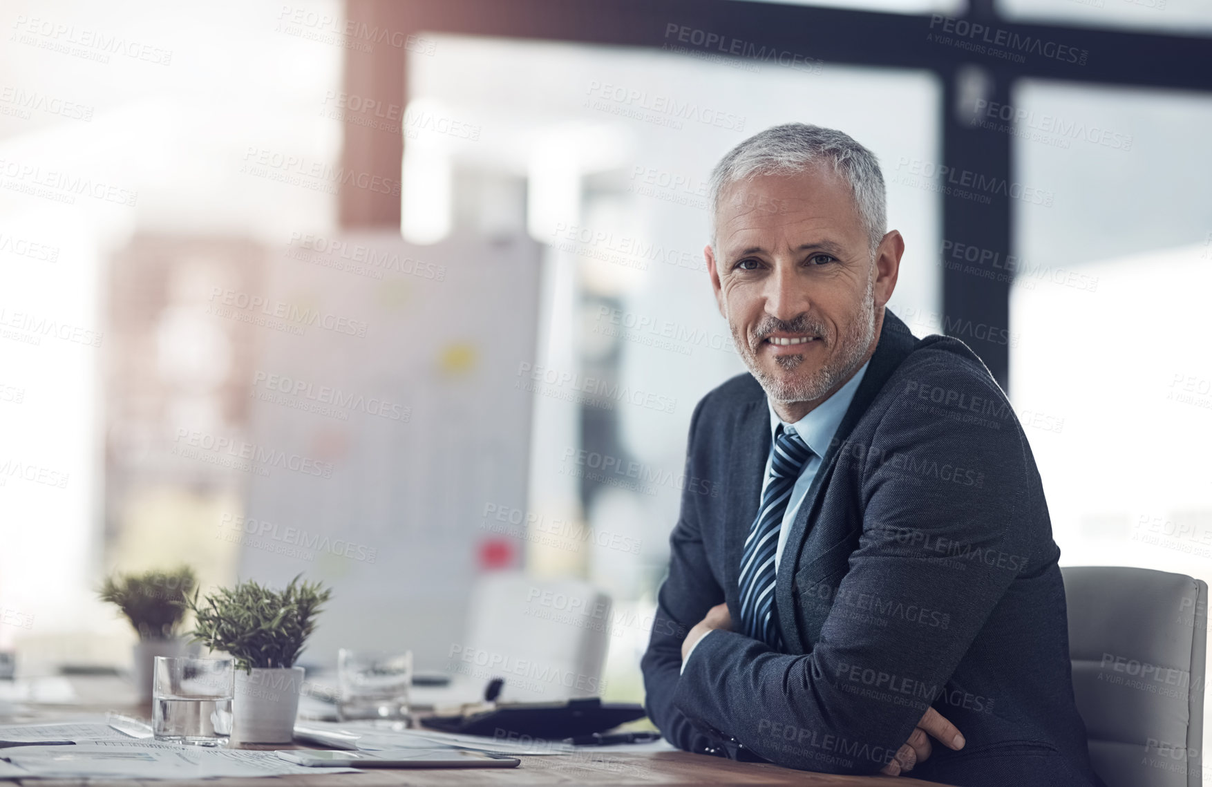 Buy stock photo Mature, businessman and portrait with pride, confidence and happiness in office or company. Male person, arms crossed and smiling at desk as accountant or professional for financial agency or banking