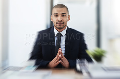 Buy stock photo Portrait of a young businessmen working at his desk in a modern office