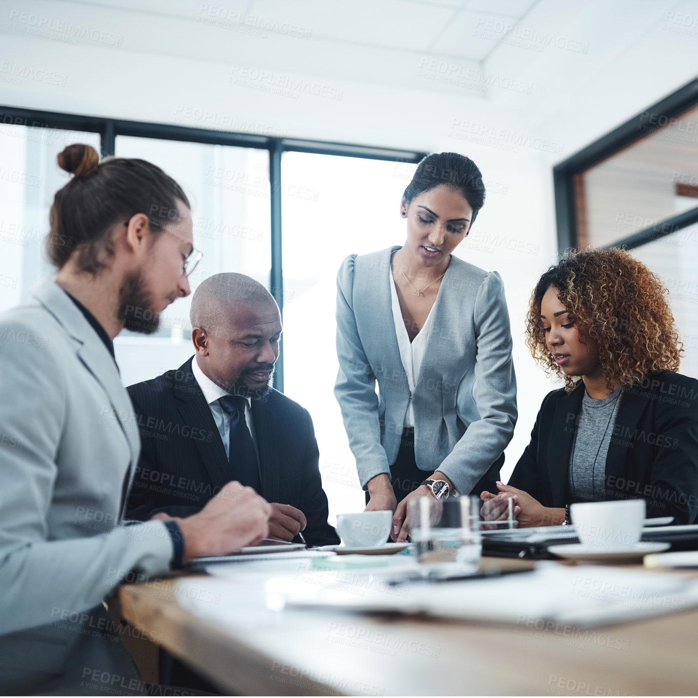 Buy stock photo Shot of a group of businesspeople having a discussion in a boardroom