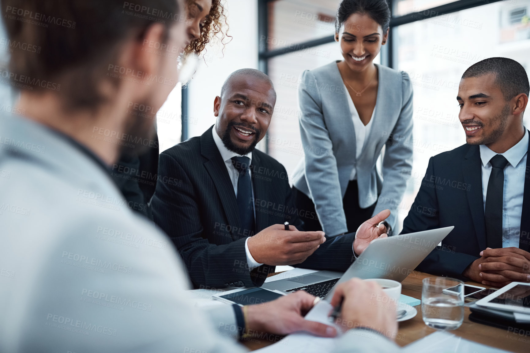 Buy stock photo Meeting, planning and happy business people with laptop in office for discussion, strategy and collaboration. Corporate, teamwork and men and women in discussion for report, group project and review