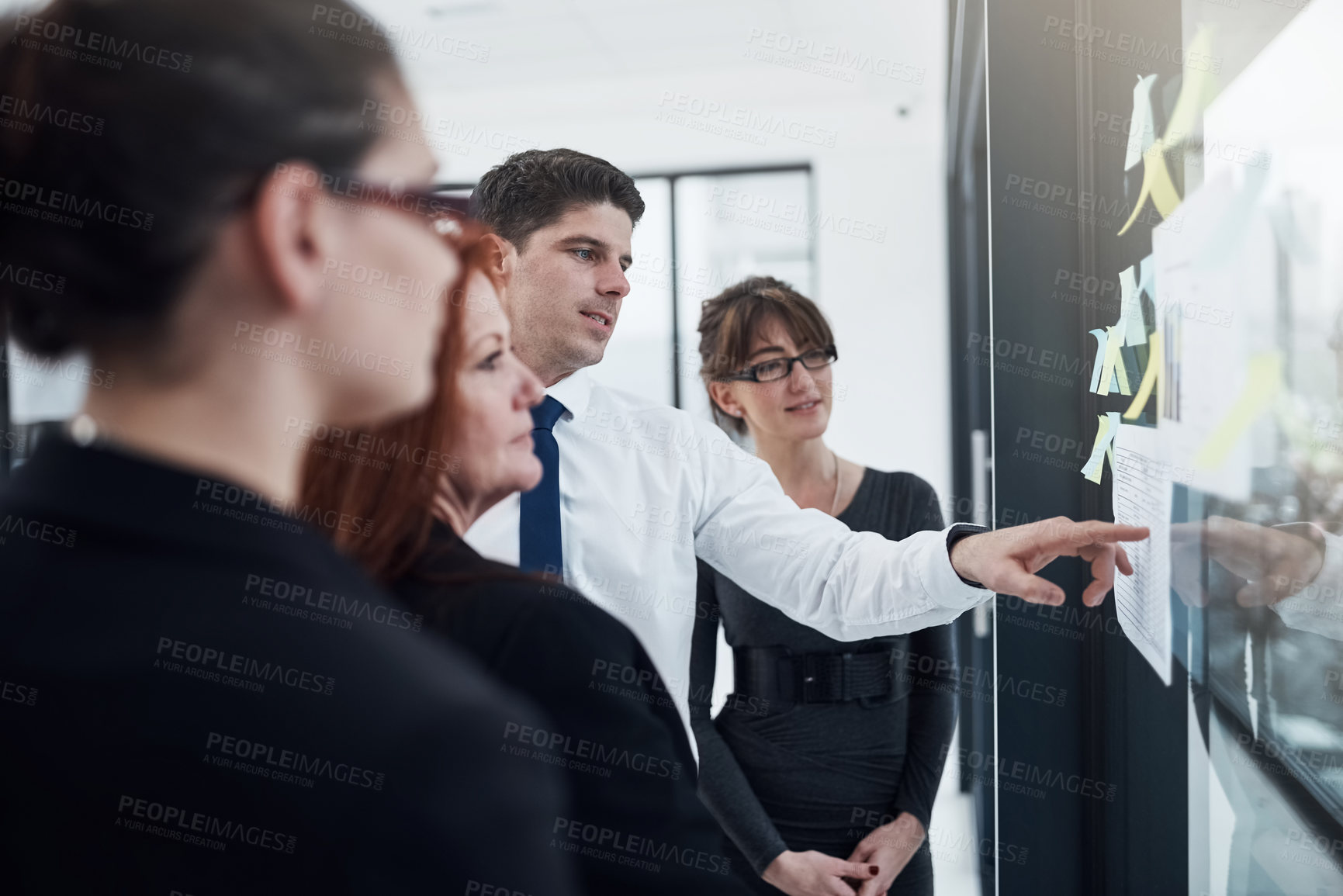 Buy stock photo Brainstorming, group and pointing at sticky notes, collaboration and colleagues with ideas and glass. Communication, teamwork and corporate people with information, underwriter and insurance company