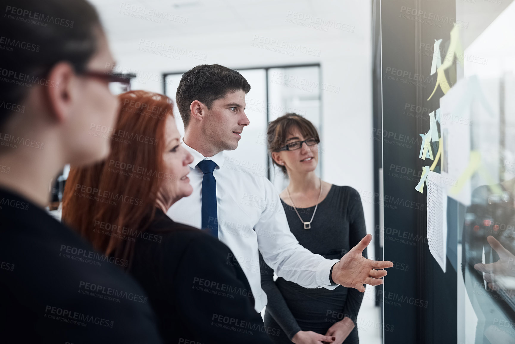 Buy stock photo Talking, reading and collaboration of group, glass and brainstorming of colleagues or ideas. Sticky notes, teamwork and corporate people with information, planning or underwriter of insurance company