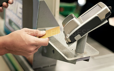 Buy stock photo Shot of an unidentifiable person paying for groceries by using a credit card machine