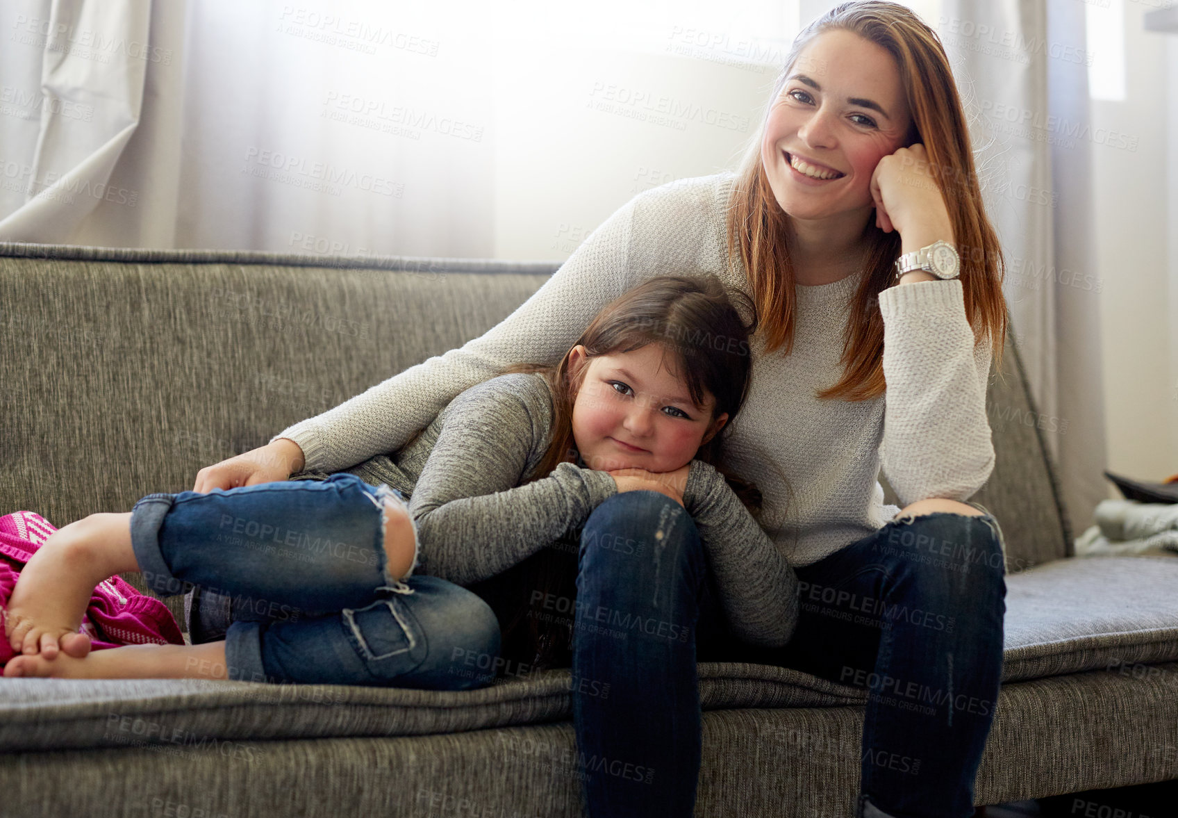 Buy stock photo Woman, girl and home together on sofa, mother and daughter for happy family and bonding. Childhood development, love and comfort for growth in living room, resting on school vacation in apartment