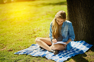 Buy stock photo Young woman, happy and notebook for study in nature for test, education and scholarship in countryside. Female student, gen z and paper by tree for learning, reading and smile for brainstorming