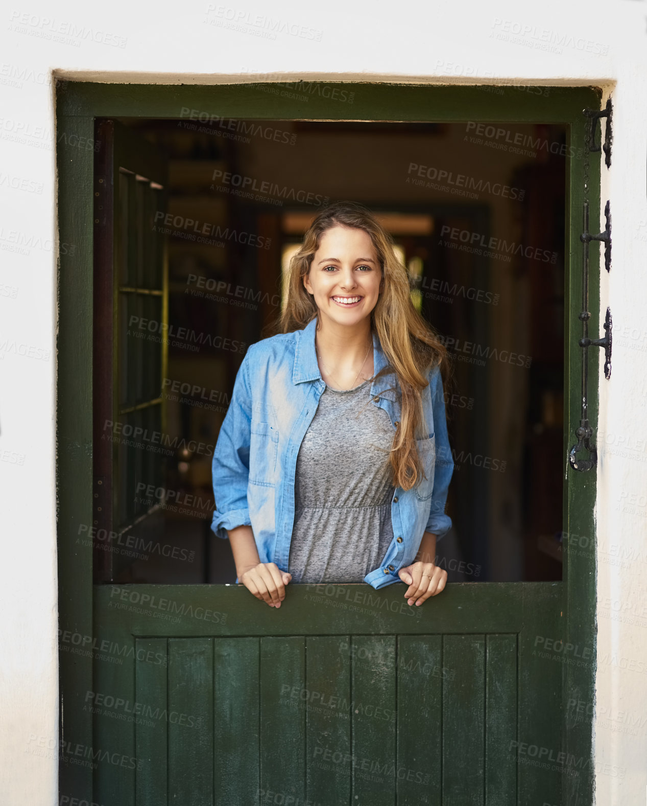 Buy stock photo Portrait of an attractive young woman standing by her back door