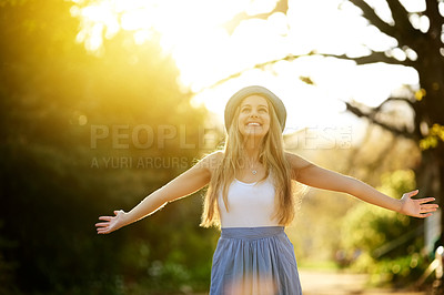 Buy stock photo Shot of an attractive young woman spending the day outdoors