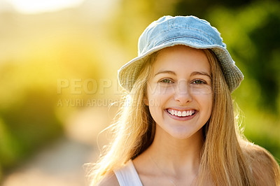 Buy stock photo Shot of an attractive young woman spending the day outdoors