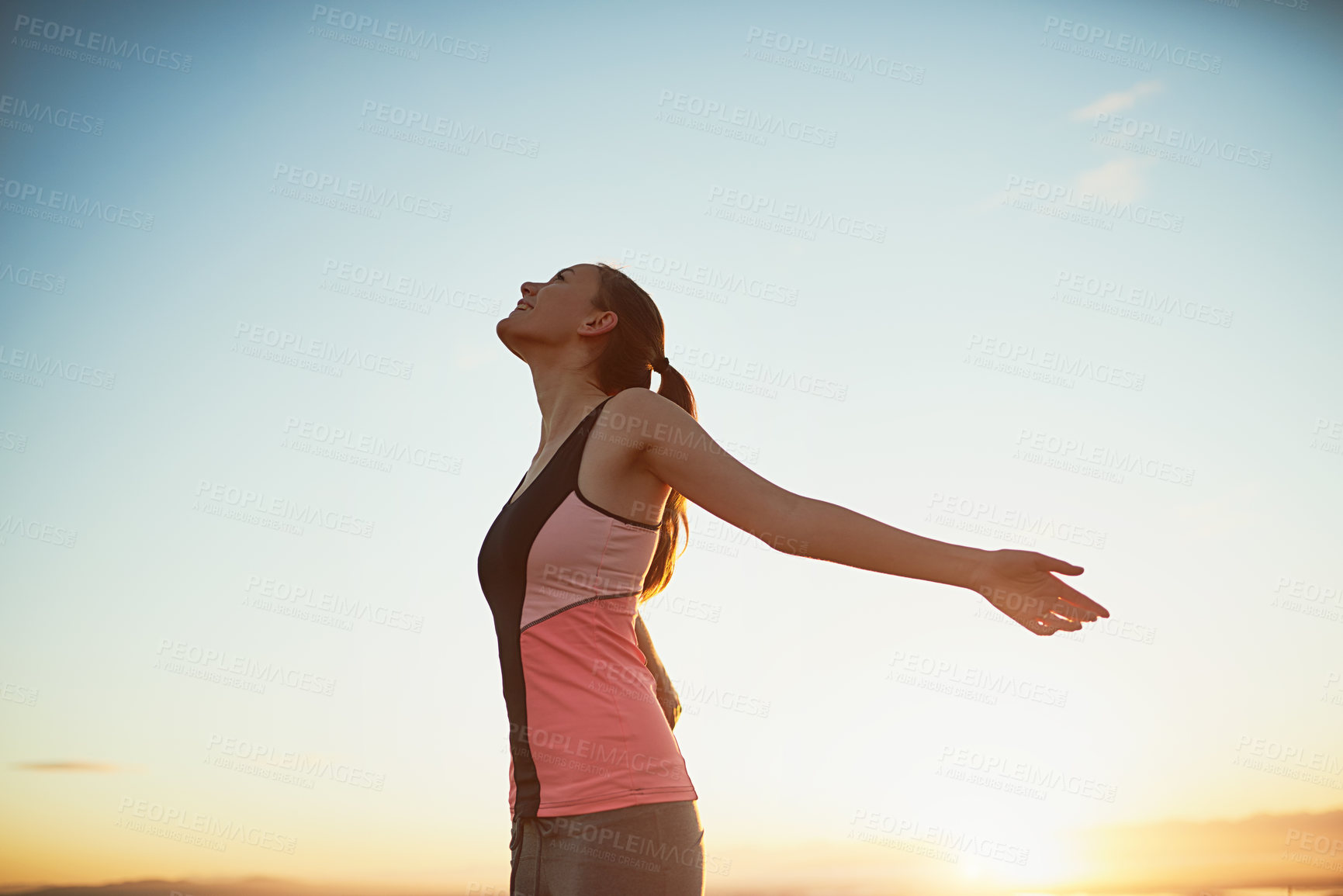 Buy stock photo Woman, happy and freedom outdoor with fitness for exercise success, workout victory and celebration. Athlete, person and hand gesture in nature with blue sky, lens flare and training achievement