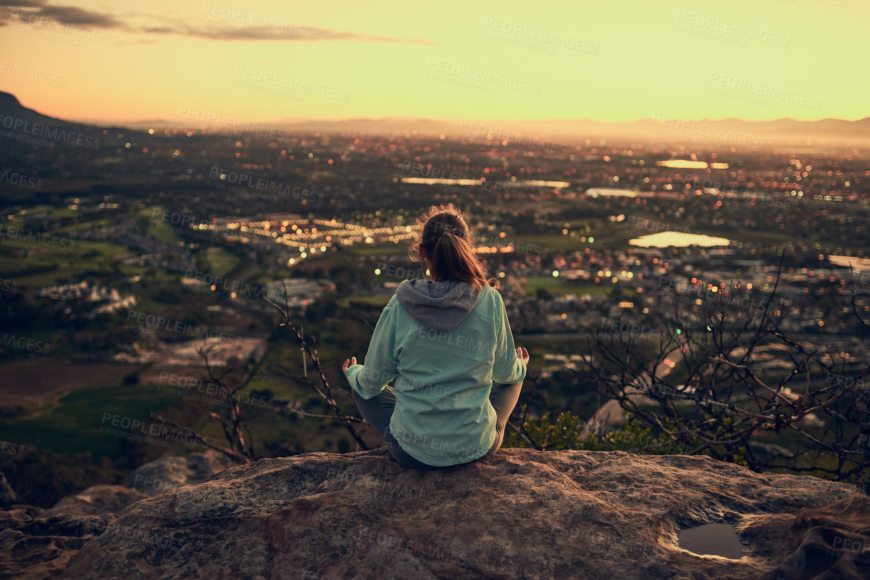 Buy stock photo Woman, meditation and lotus on mountain in nature with rear view for warm up, yoga and fitness with sunrise. Yogi, pilates and person with outdoor for exercise, posture and balance with city lights