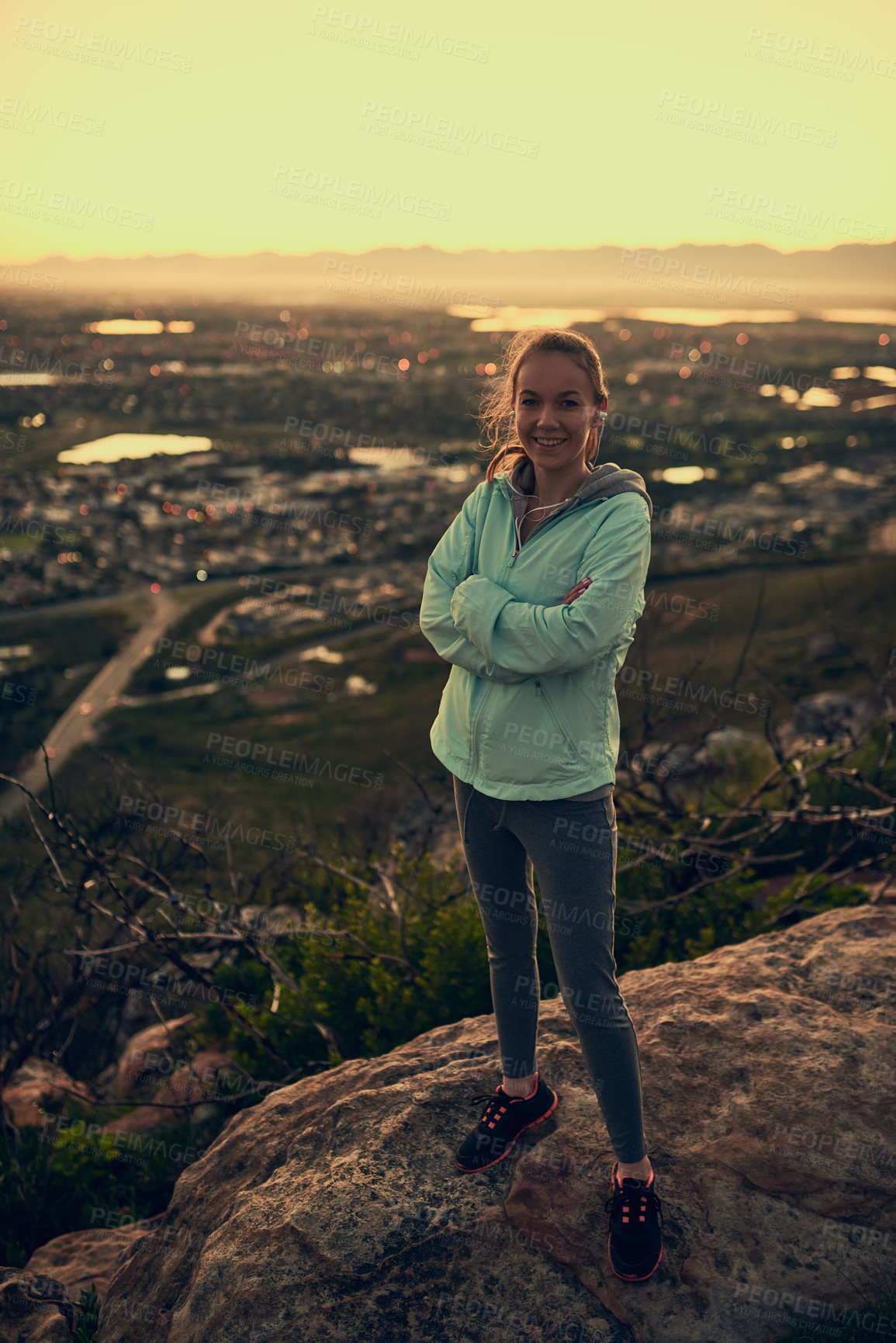 Buy stock photo Happy woman, portrait and hiker with confidence on mountain for outdoor exercise, workout or training. Female person with smile or arms crossed on rock trail for trekking, hiking or journey in nature