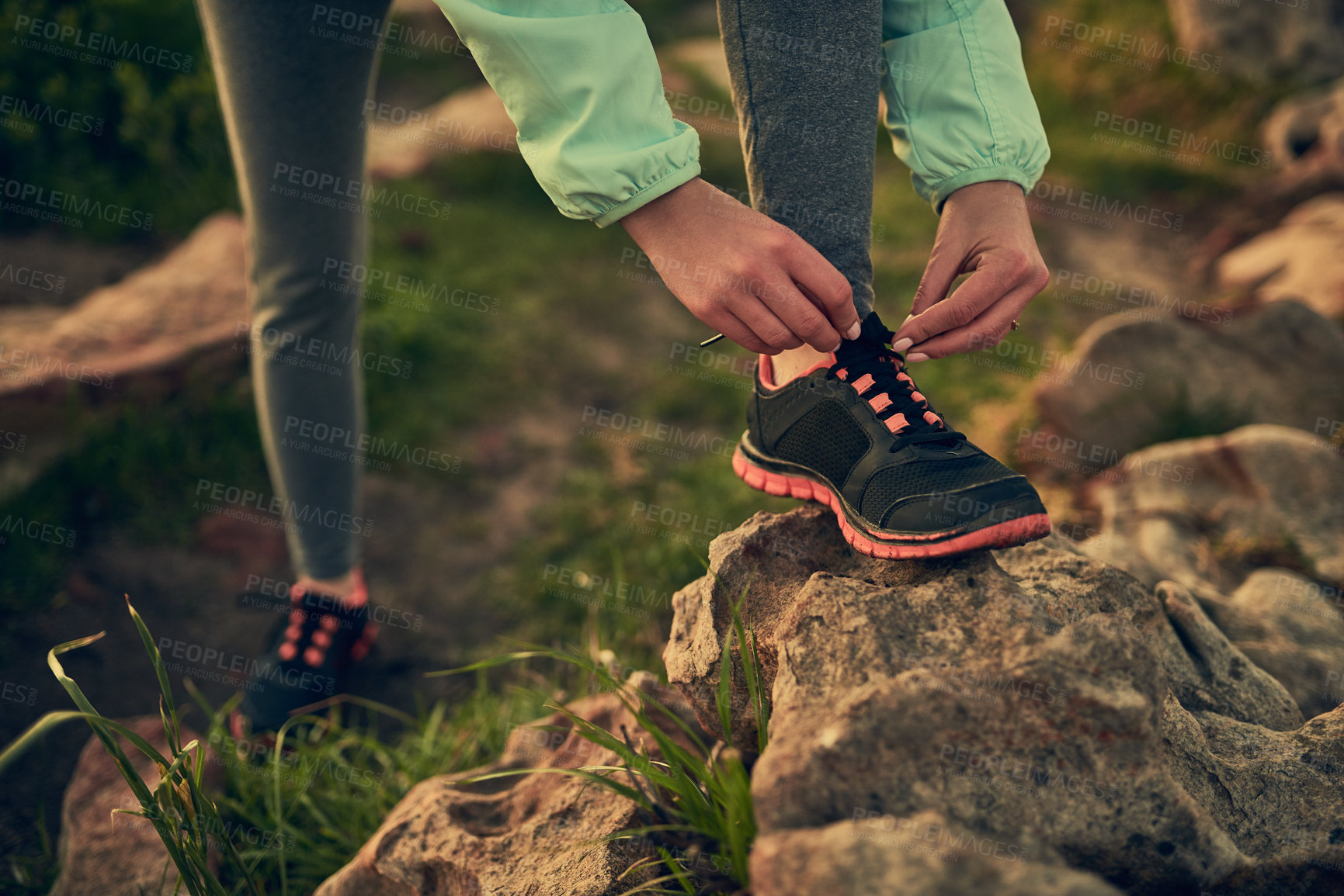 Buy stock photo Person, hands and tie shoes with rock of hiker for morning walk or trekking on outdoor mountain. Closeup of human getting ready, preparation or tying laces for hiking, journey or exercise in nature