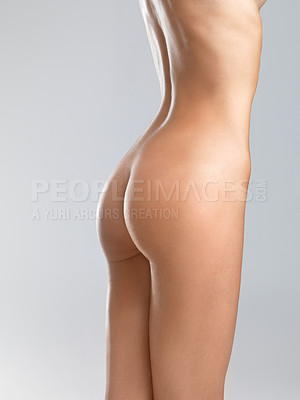 Buy stock photo Cropped image of a attractive young womans rear, thighs and torso