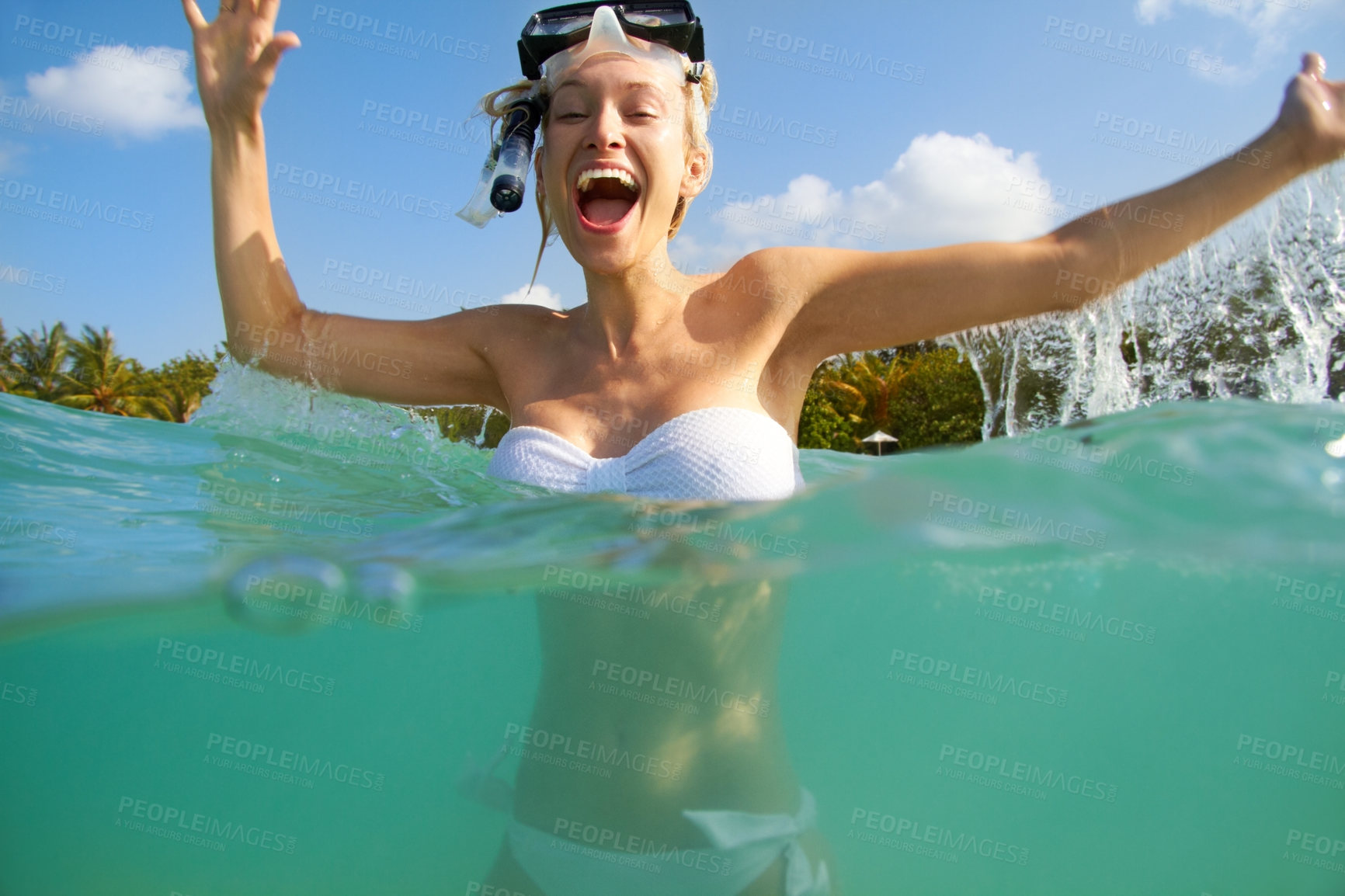 Buy stock photo Portrait of an excited young woman in the ocean wearing snorkelling gear