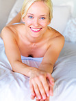 Pretty blond lying on a bed