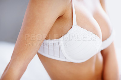Buy stock photo Closeup, sexy and lingerie with boobs of woman in bedroom for sensual, confidence or fashion. Relax, temptation and desire with breasts of girl in underwear in house for sexuality, flirting or sexual