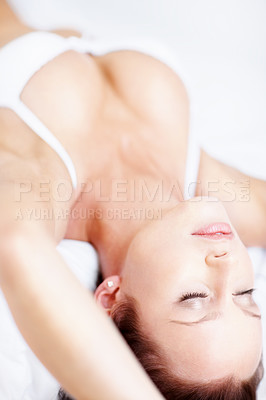 Buy stock photo Relaxed sensuous woman lying on bed in lingerie