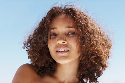 Buy stock photo Beauty, blue sky and portrait of young woman with curly hairstyle and glamour face and positive attitude. Happy, outdoor and pretty natural female person from Colombia with glow for confidence.