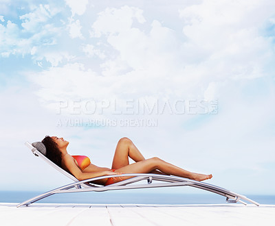 Buy stock photo Outdoor, chair and woman with summer, vacation and holiday with sky background, relax and clouds. Person, travelling and girl with beach, water and ocean with peace, space and adventure with journey