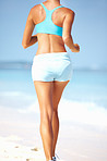 Woman jogging at beach