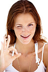 Happy young lady giving ok sign